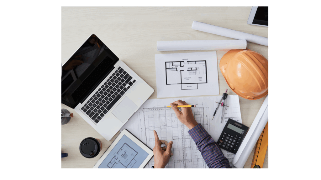 机上に図面・パソコン・電卓・コンパ等のツールとともに課題解決に取り組む写真で、若手中堅技術者への想いを表した